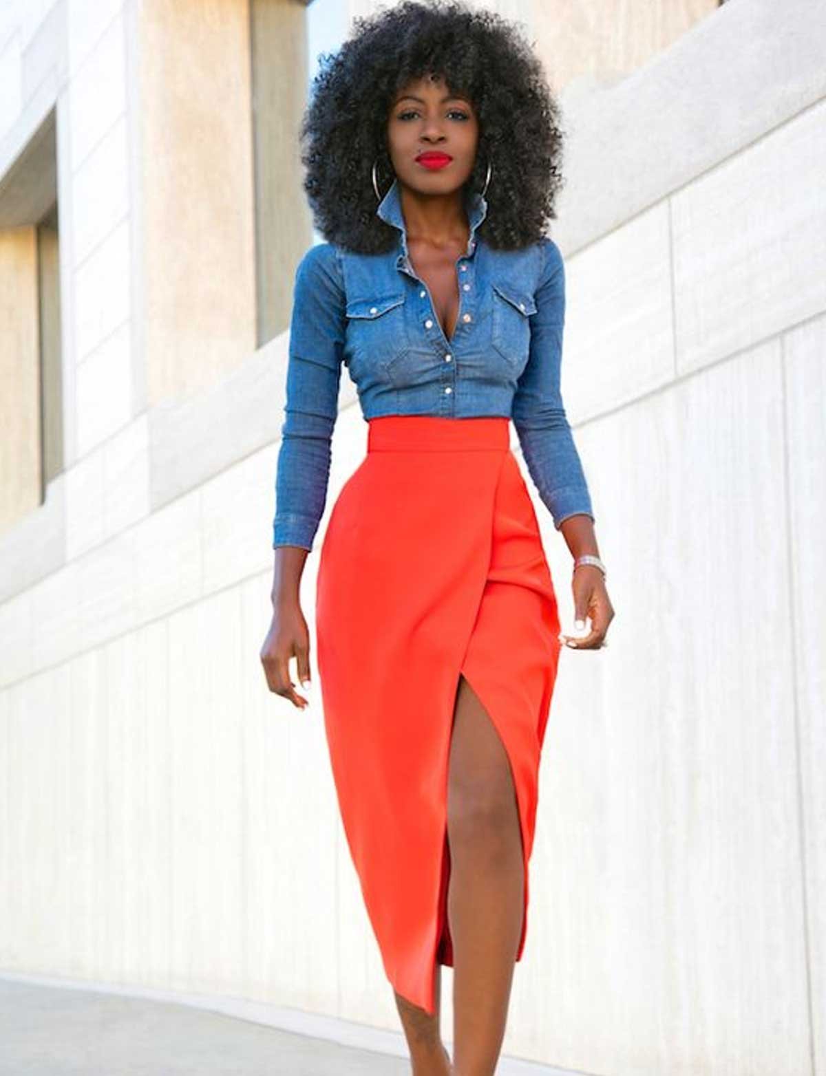 A bright-colored long slit skirt with a body-hugging denim shirt
